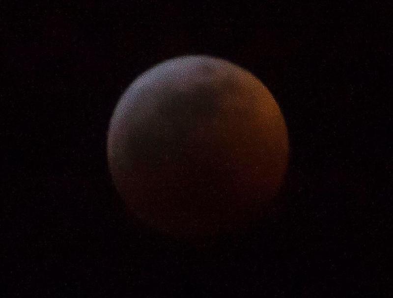 The lunar eclipse at 10:48 pm. f/5.6, 1/15 sec, ISO-1600, 250 mm