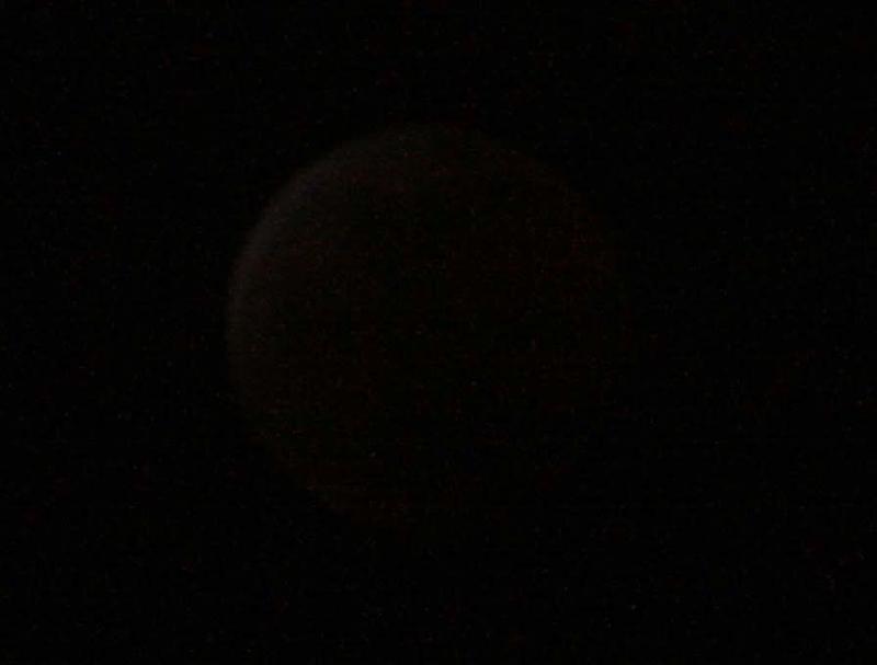 The lunar eclipse at 11:10 pm (almost totality). f/5.6, 1/25 sec, ISO-1600, 250 mm